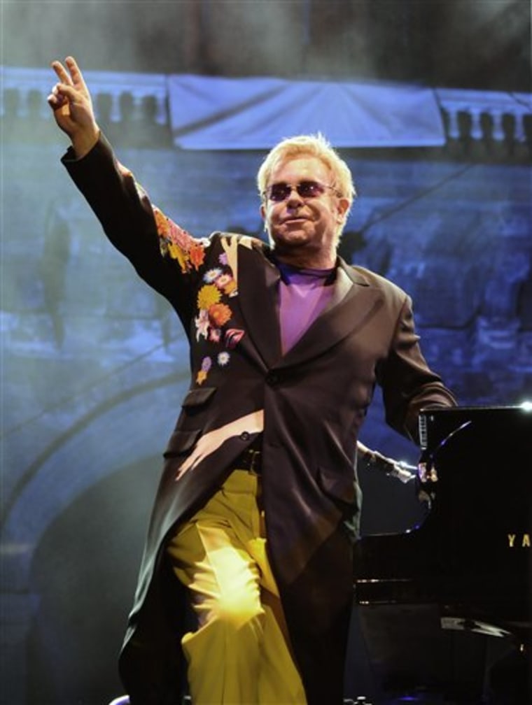 Elton John salutes the audience during his performance at the Piedigrotta festival in Naples. The European Union wants to know why some of its development funds were used for this concert at a time when the financial crisis was forcing member nations into austerity. 